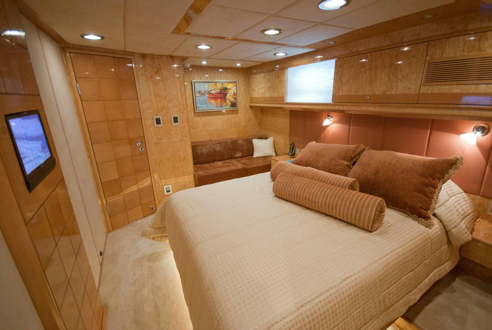 a room with a bed and a tv aboard RED PEARL Yacht for Sale