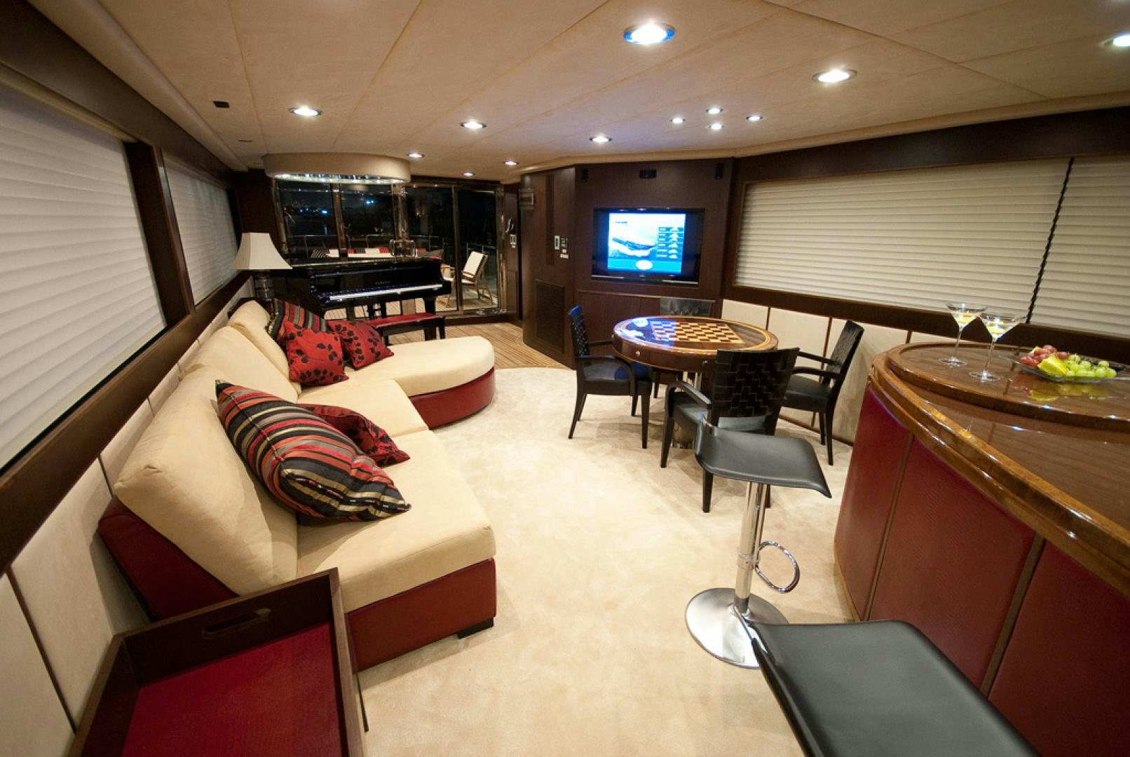 a living room with a couch and a tv aboard RED PEARL Yacht for Sale