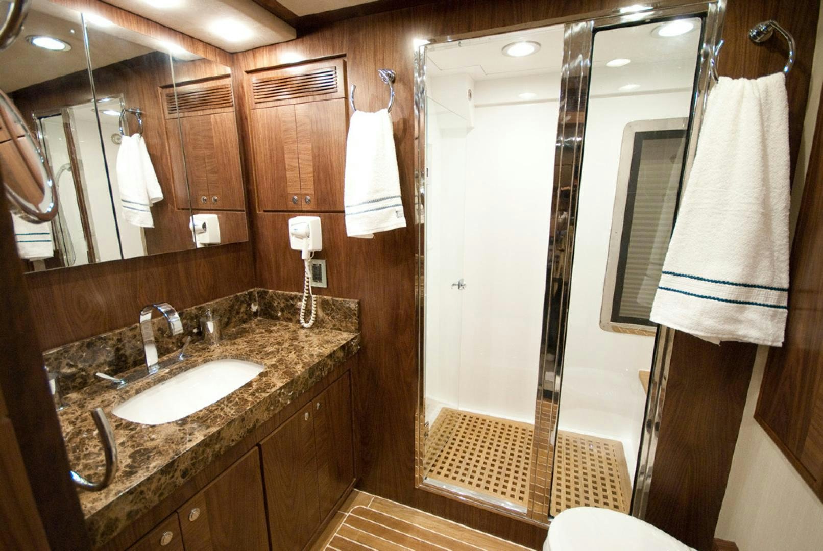 a bathroom with a sink and shower aboard RED PEARL Yacht for Sale
