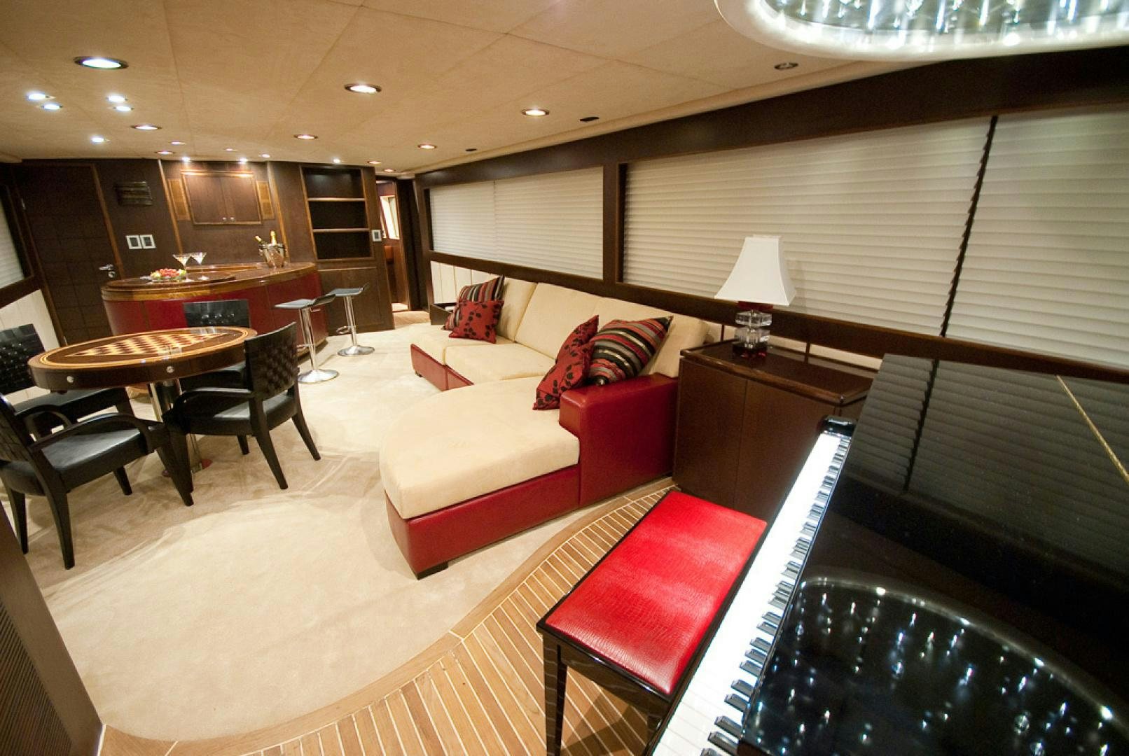 a living room with a couch and a table aboard RED PEARL Yacht for Sale