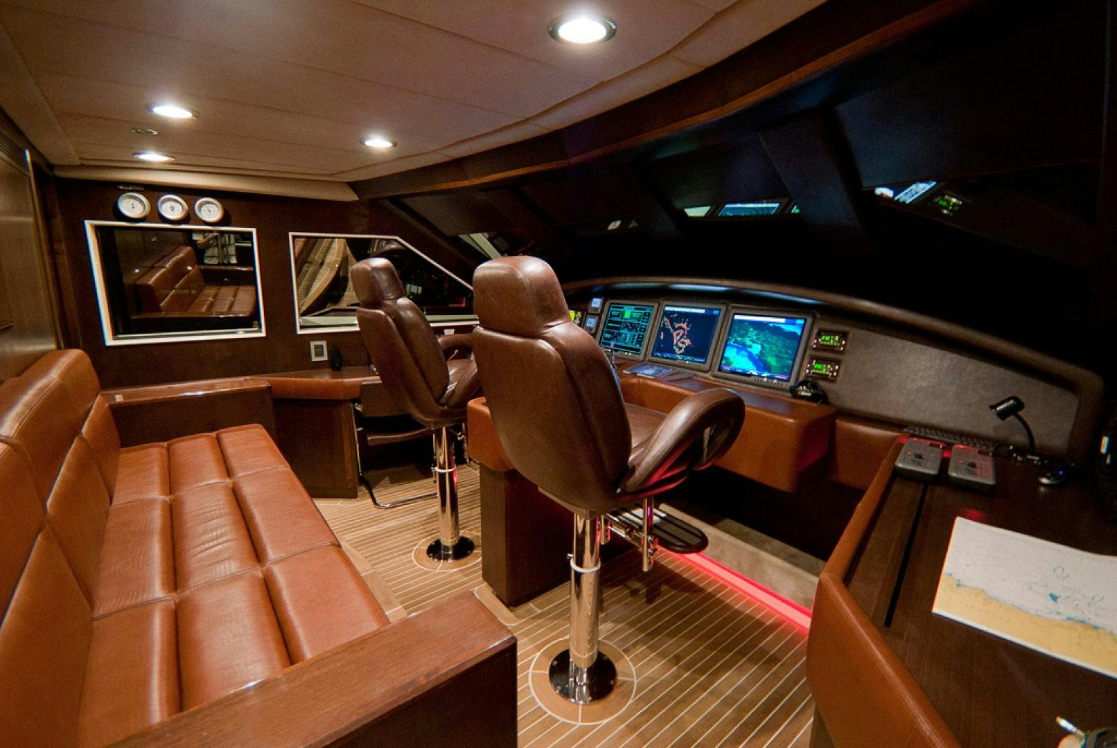 a room with a couch and a chair and a desk with a computer aboard RED PEARL Yacht for Sale
