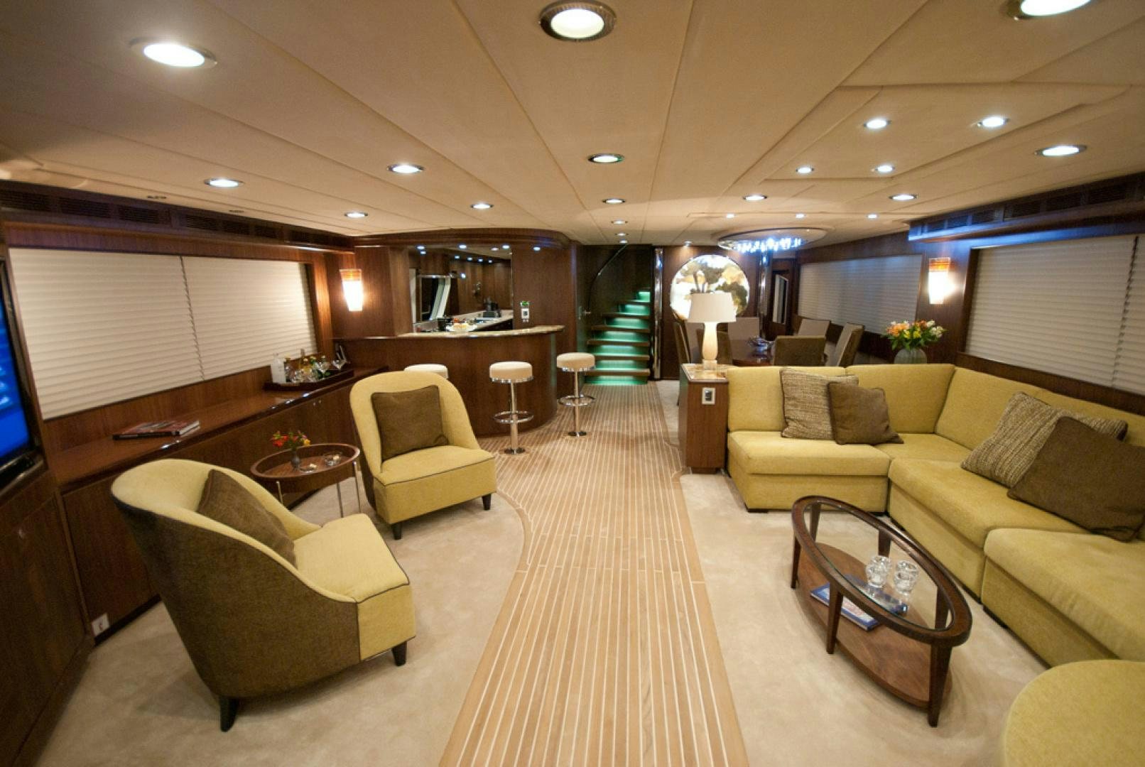 a living room with a couch and a coffee table aboard RED PEARL Yacht for Sale