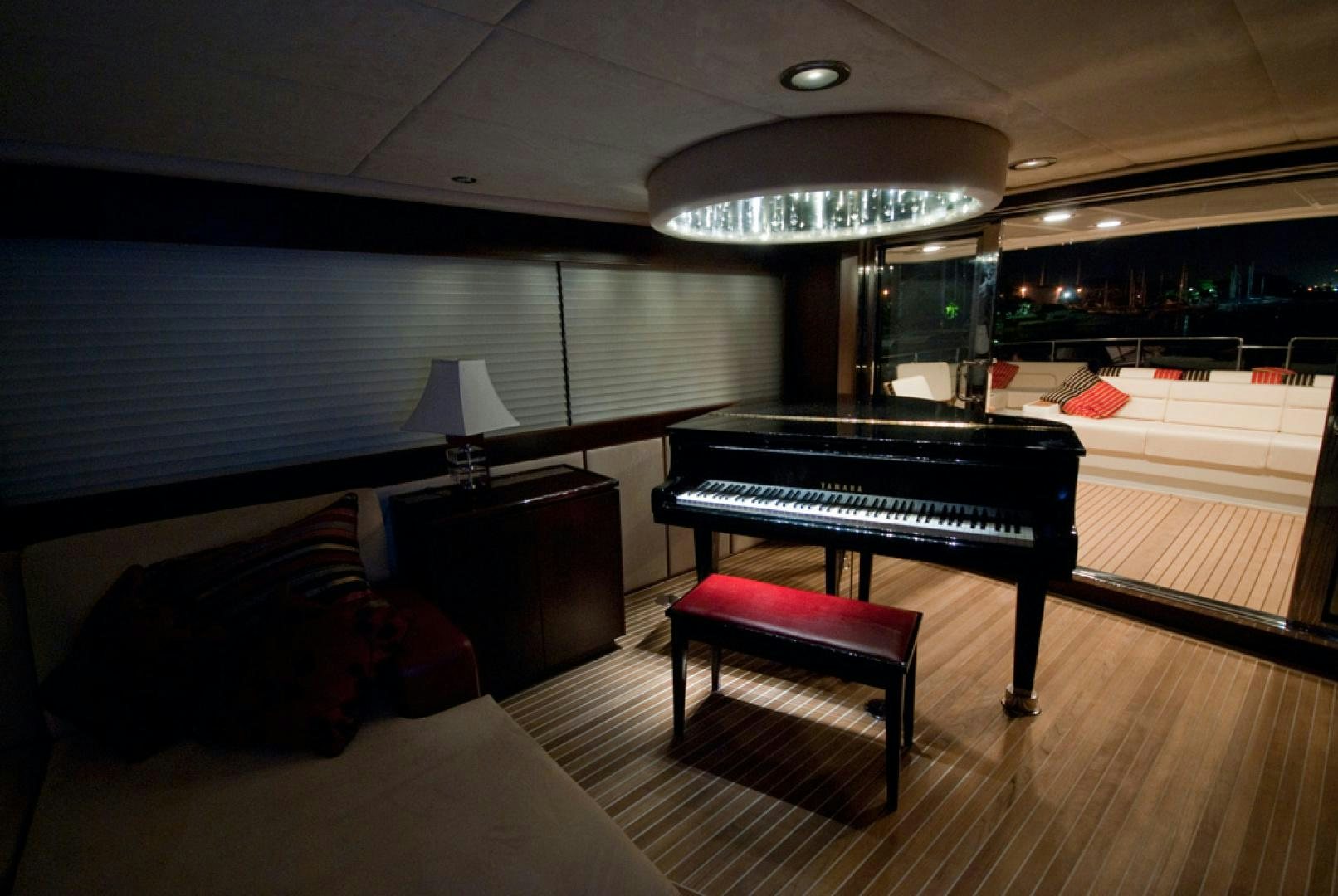 a room with a piano and a piano aboard RED PEARL Yacht for Sale