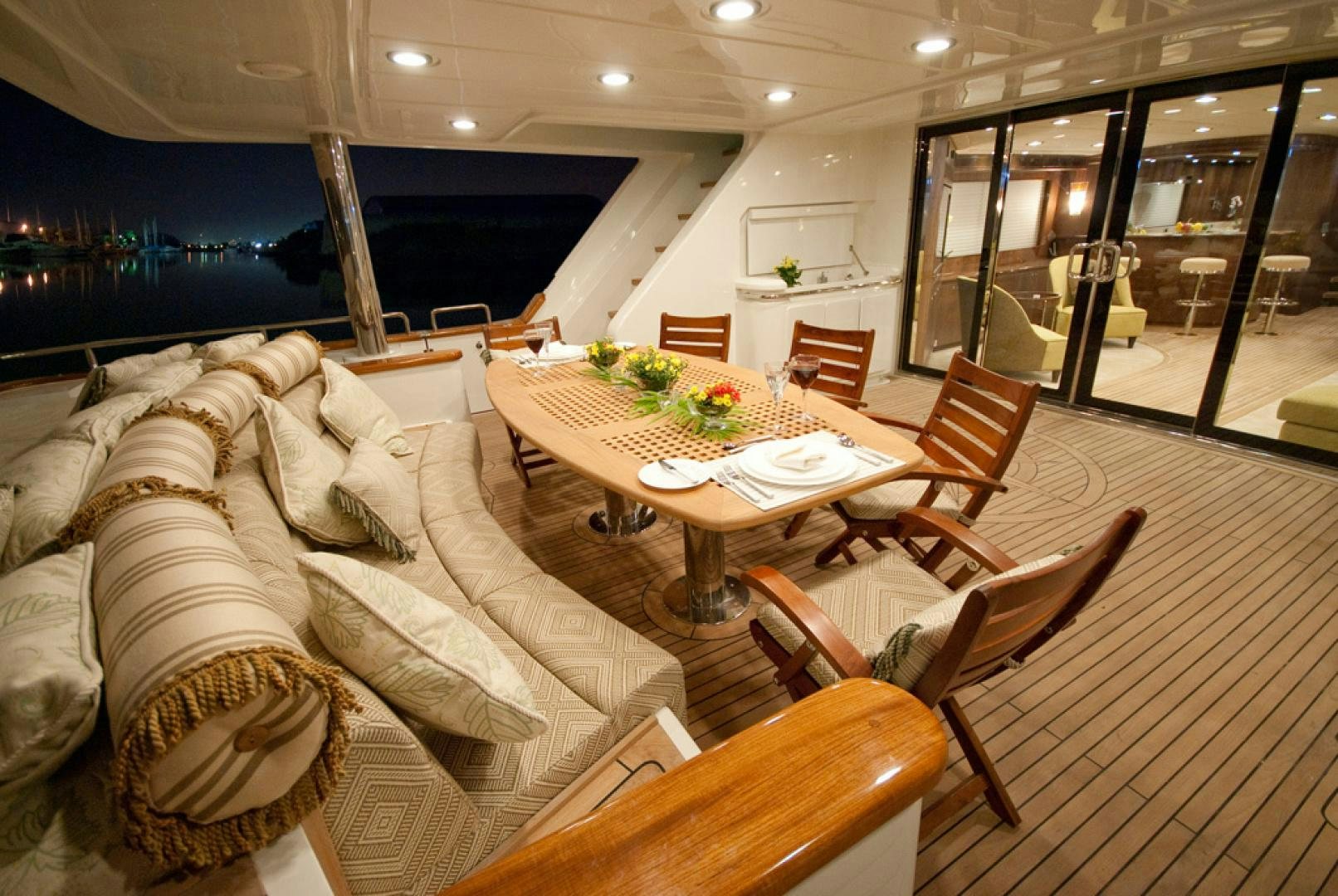 a room with a table and chairs aboard RED PEARL Yacht for Sale