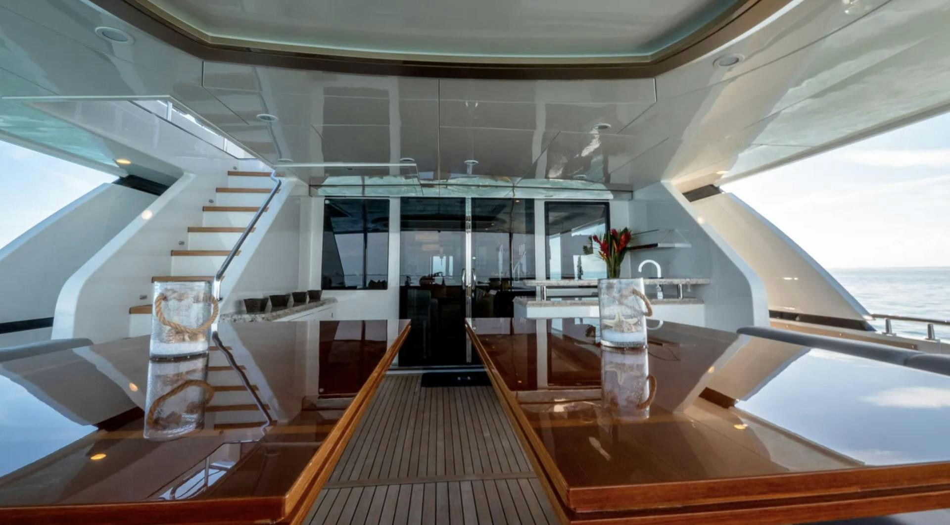a room with a wood floor and a staircase aboard SEA N SEA Yacht for Charter