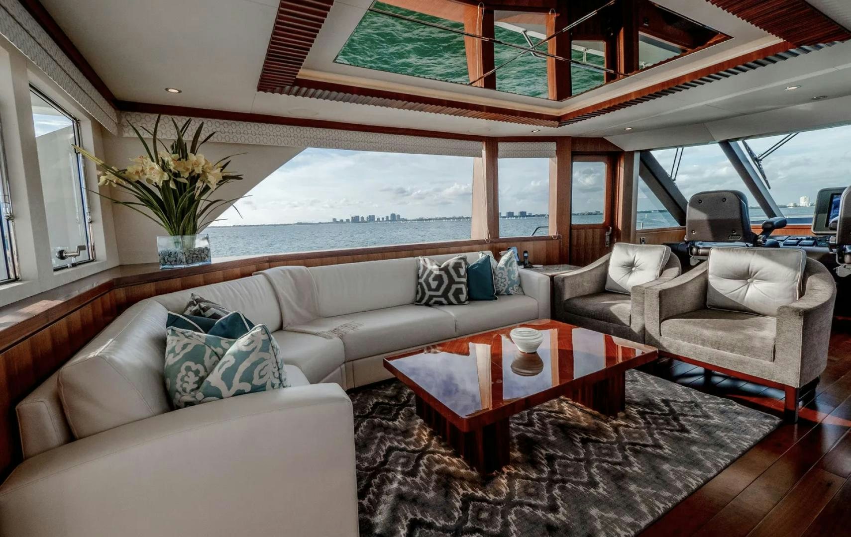 a living room with a large window aboard SEA N SEA Yacht for Charter