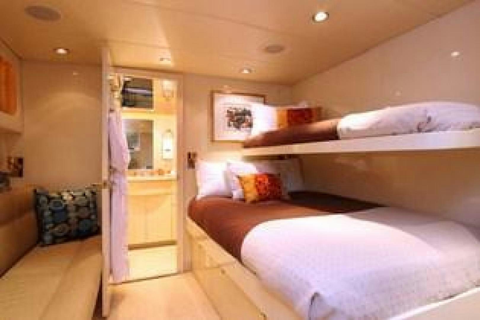 a person lying on a bed aboard HARLINA Yacht for Sale