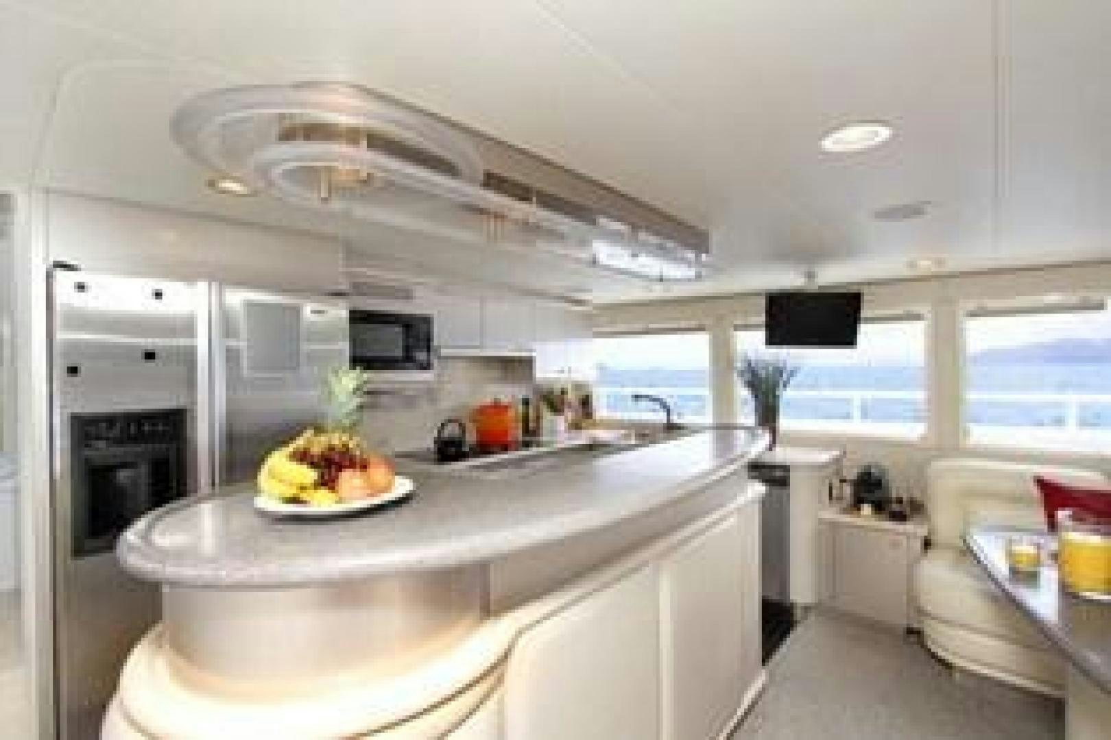a kitchen with a bowl of fruit aboard HARLINA Yacht for Sale