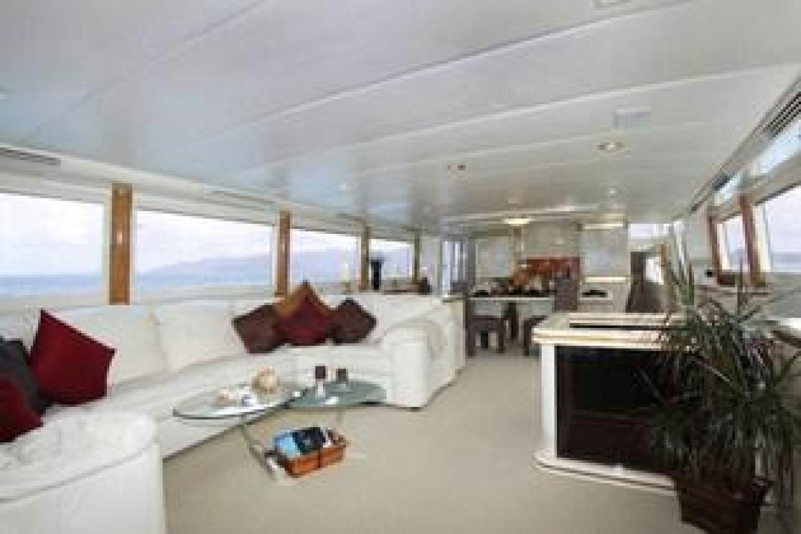 a large living room with a large window aboard HARLINA Yacht for Sale