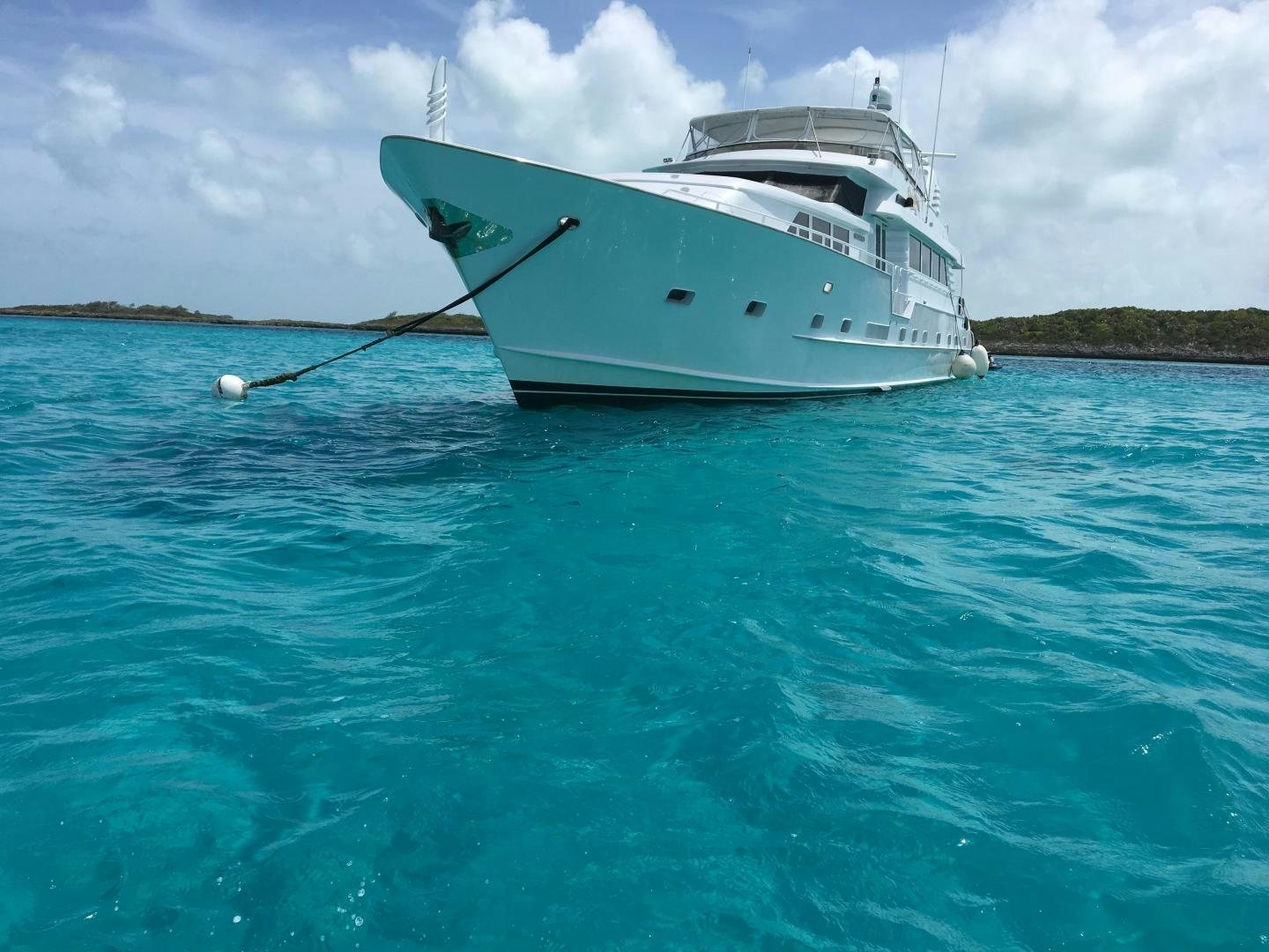 a white boat in the water aboard HARLINA Yacht for Sale