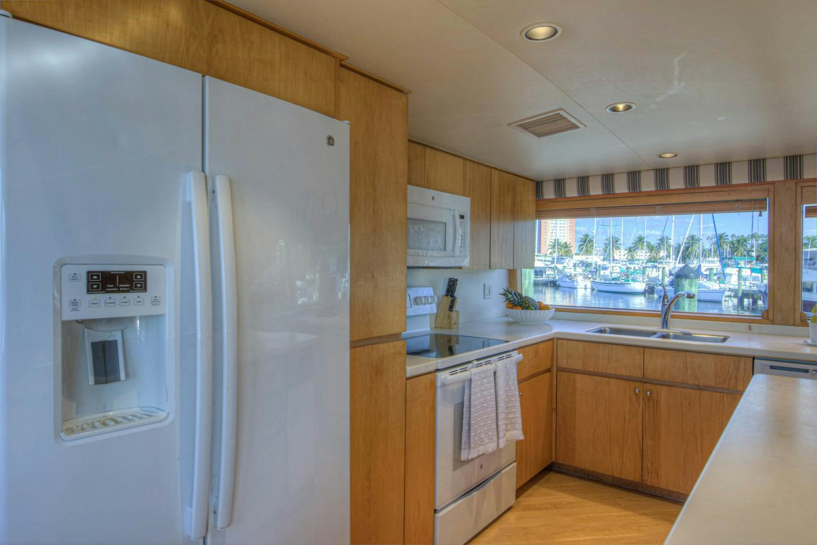 a kitchen with a refrigerator aboard LADY LEX Yacht for Sale