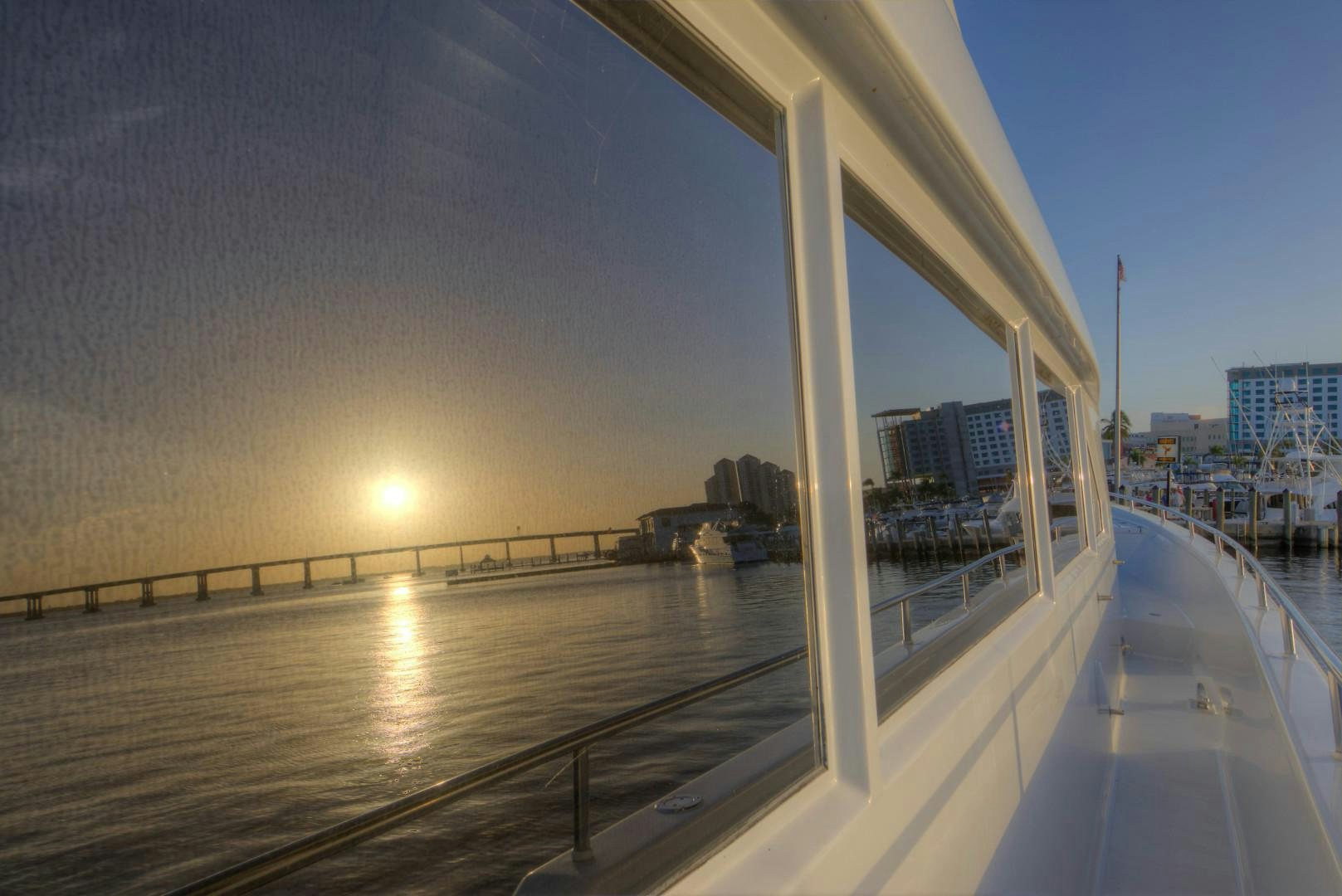 a large building with a body of water in the front aboard LADY LEX Yacht for Sale