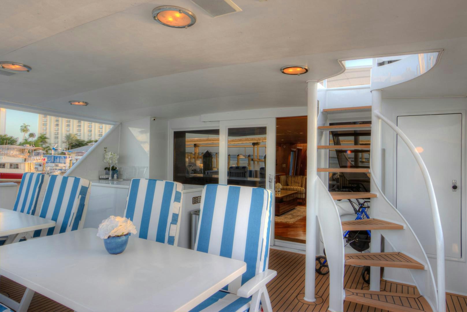 a dining room with a table and chairs aboard LADY LEX Yacht for Sale