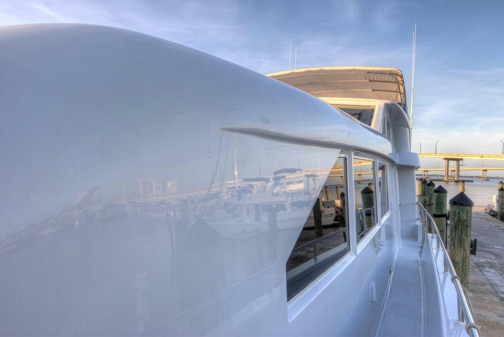 a reflection of a building in a glass window aboard LADY LEX Yacht for Sale