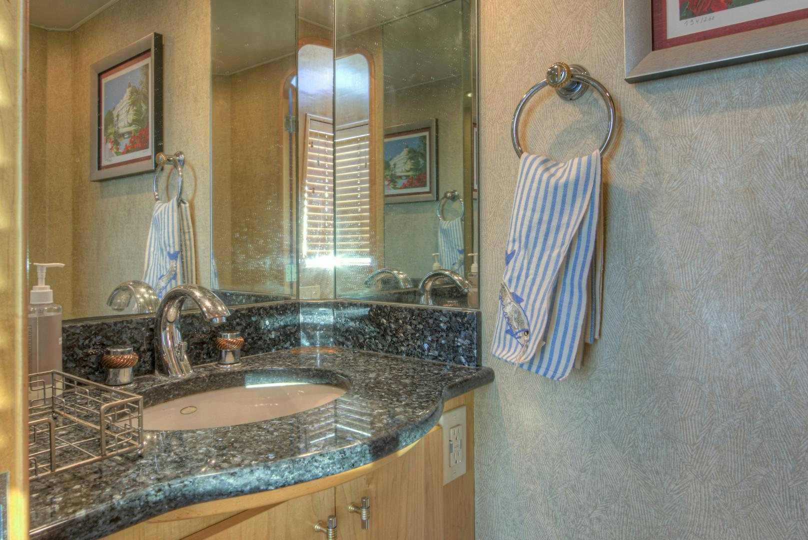 a bathroom with a sink and a mirror aboard LADY LEX Yacht for Sale