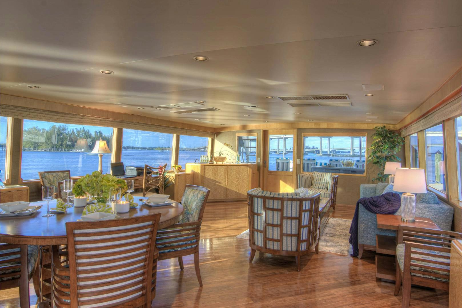 a living room with a wood floor aboard LADY LEX Yacht for Sale