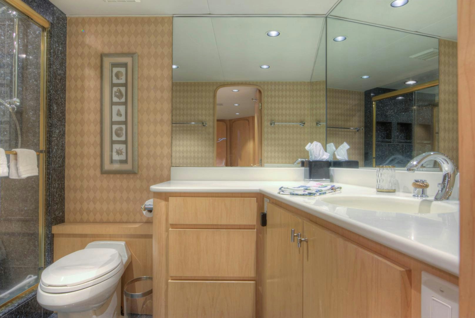a bathroom with a sink and a toilet aboard LADY LEX Yacht for Sale