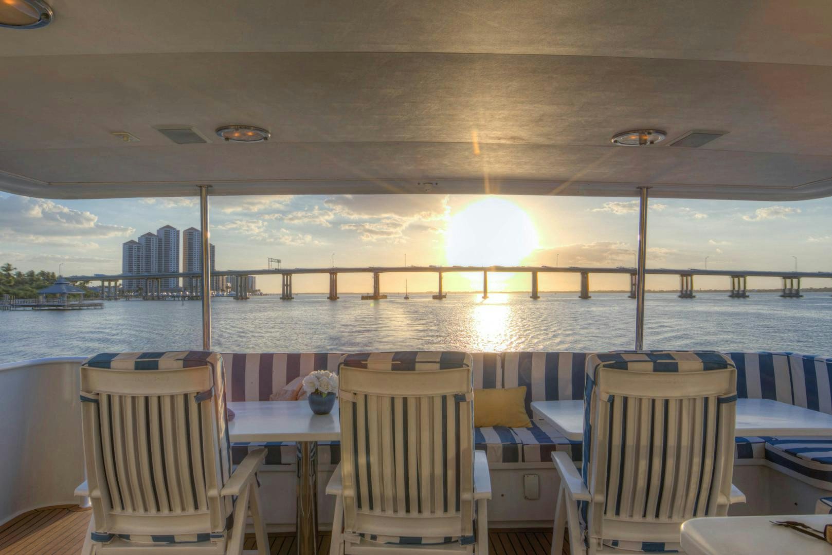 a room with a view of the water and a city aboard LADY LEX Yacht for Sale