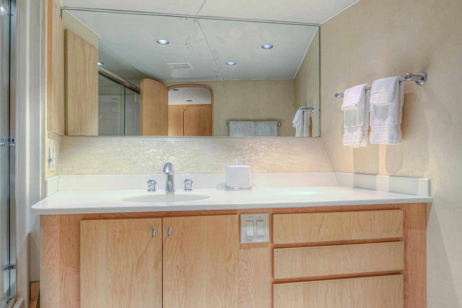 a bathroom with a large mirror aboard LADY LEX Yacht for Sale