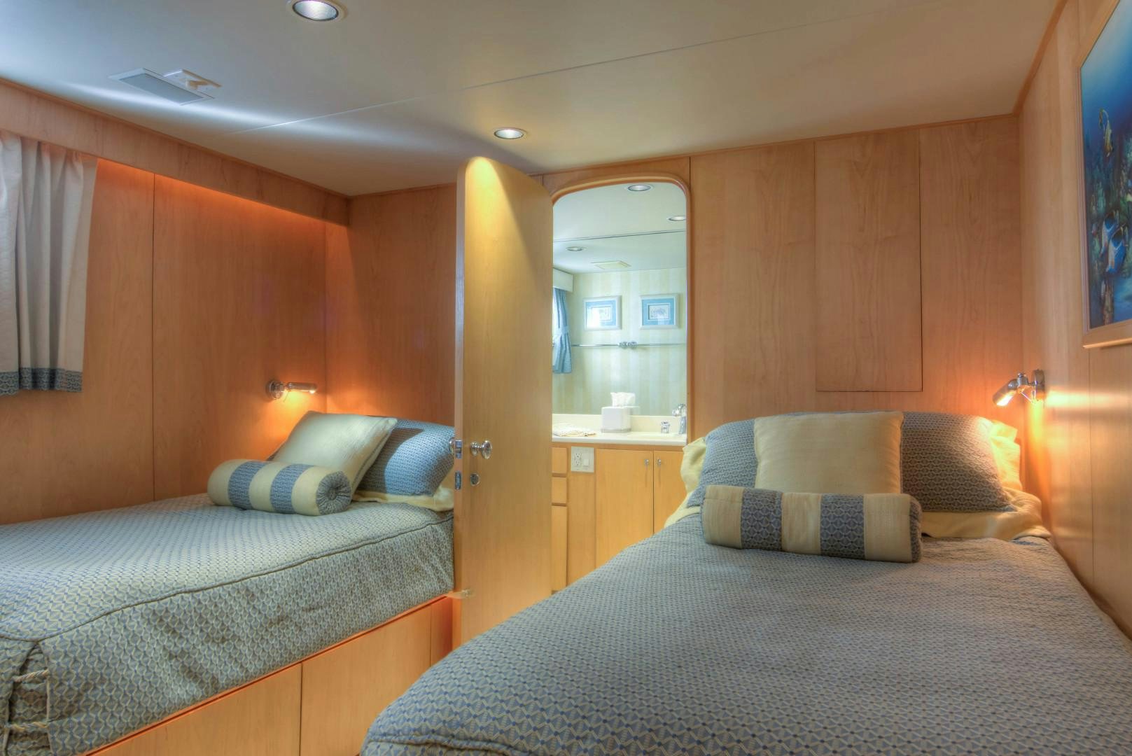 a room with two beds aboard LADY LEX Yacht for Sale