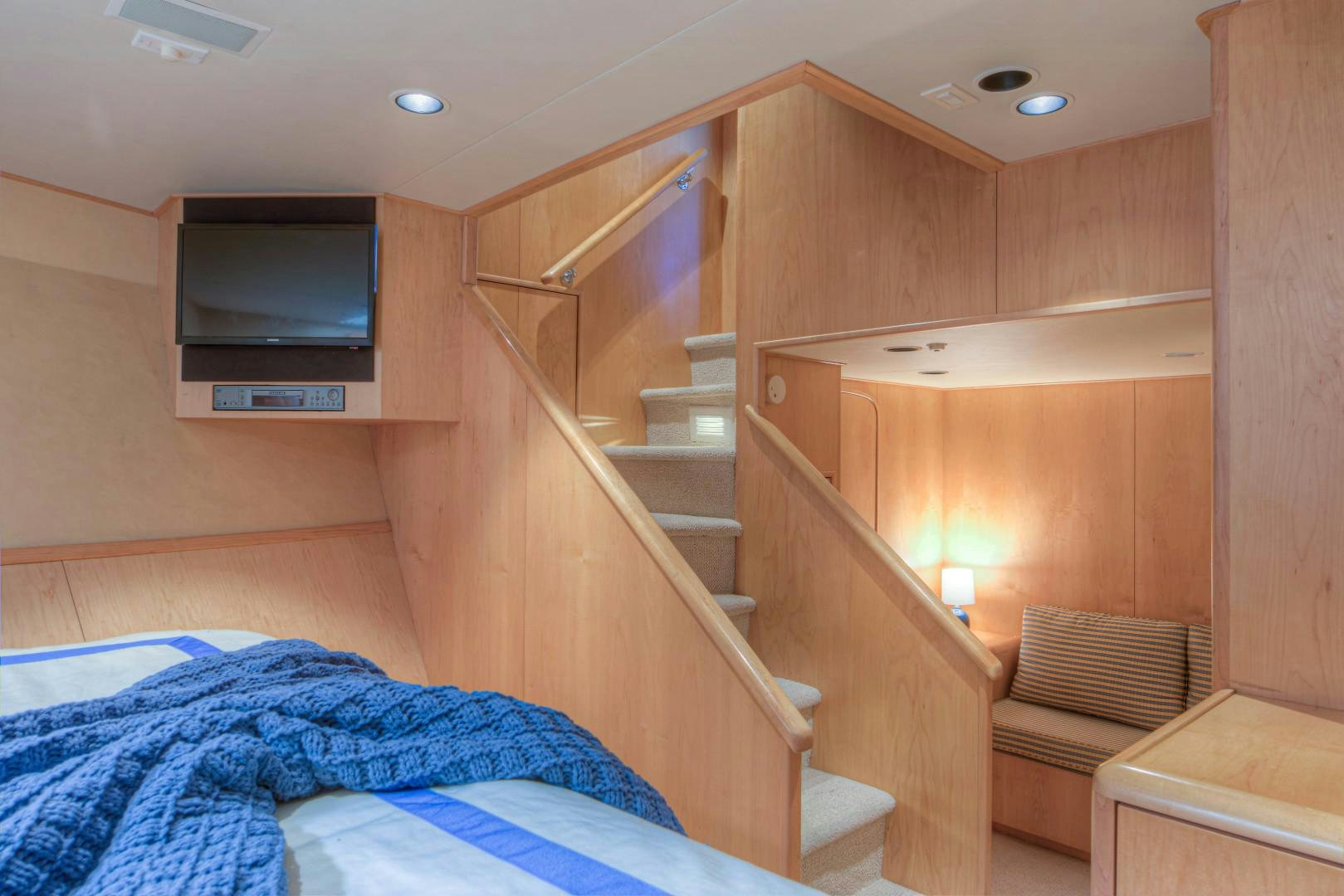 a room with a bunk bed and a couch aboard LADY LEX Yacht for Sale