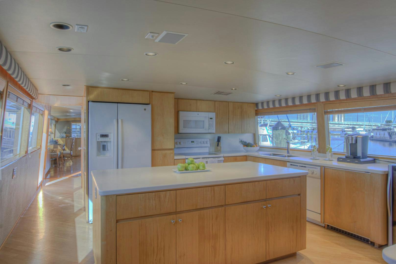 a kitchen with white cabinets aboard LADY LEX Yacht for Sale