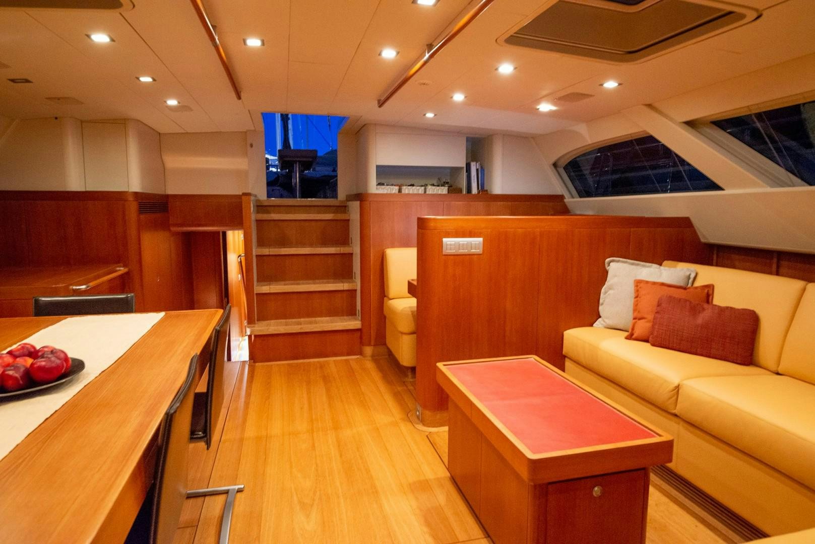 a living room with a couch and a table aboard VARSOVIE Yacht for Sale
