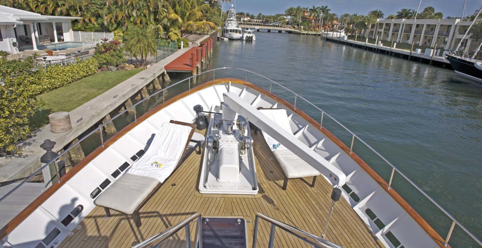 a large boat on a body of water aboard BRAVO Yacht for Sale