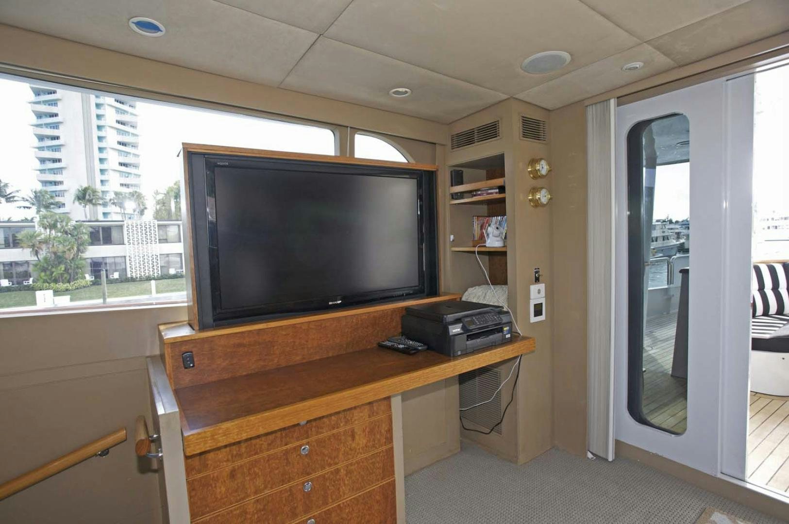 a room with a tv and a desk aboard BRAVO Yacht for Sale