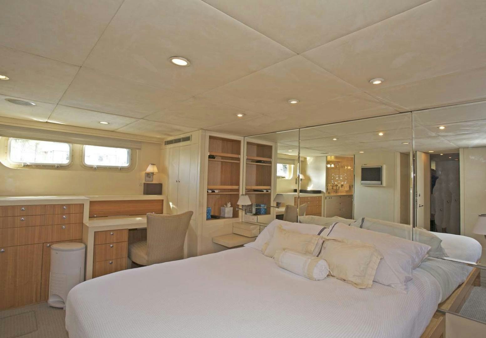 a large bedroom with a large bed aboard BRAVO Yacht for Sale