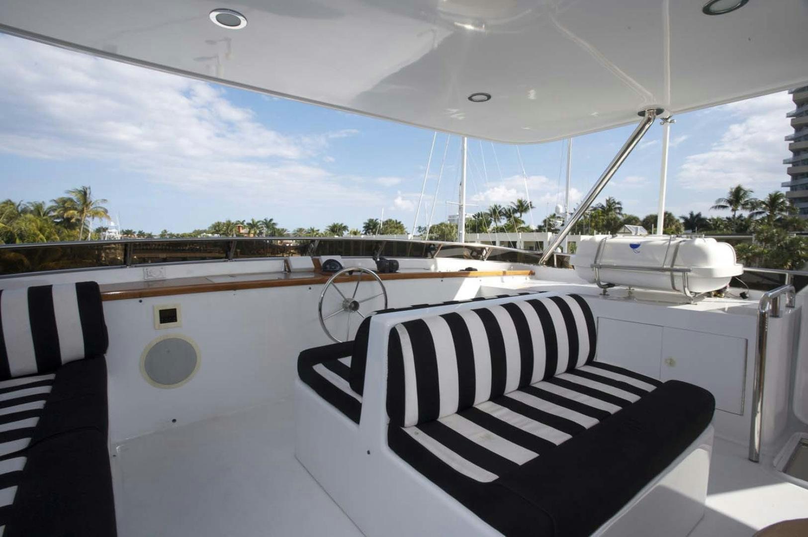 a white boat on a deck aboard BRAVO Yacht for Sale