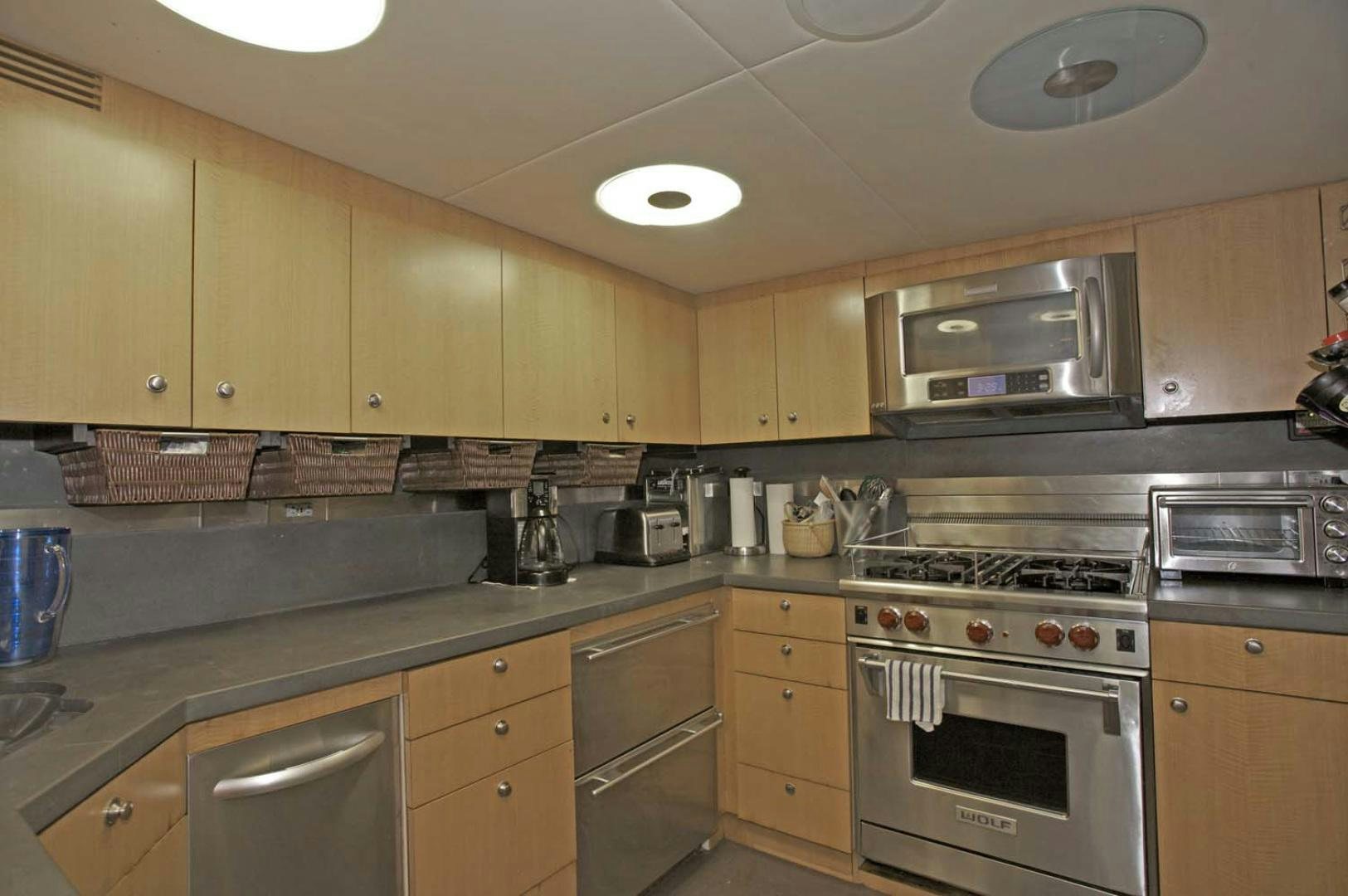 a kitchen with a stove and oven aboard BRAVO Yacht for Sale