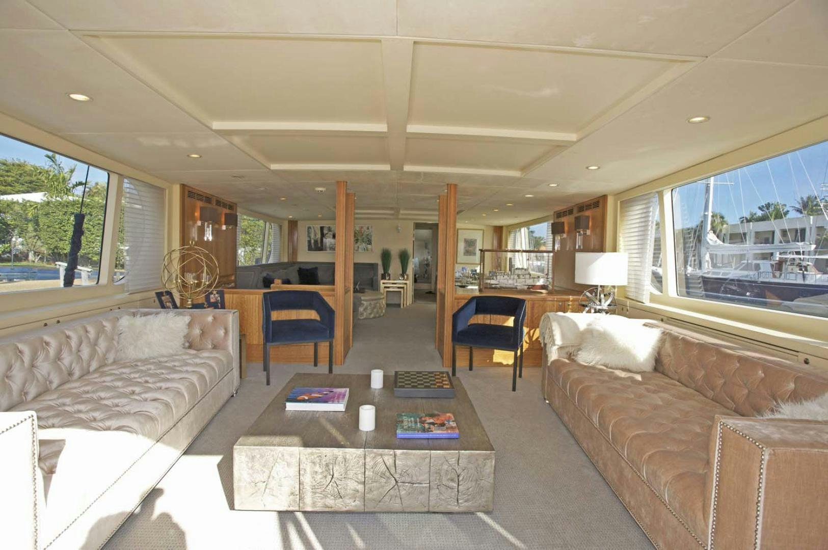a living room with a couch and a coffee table aboard BRAVO Yacht for Sale