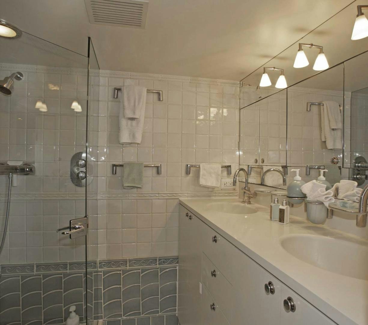 a bathroom with a shower and sink aboard BRAVO Yacht for Sale