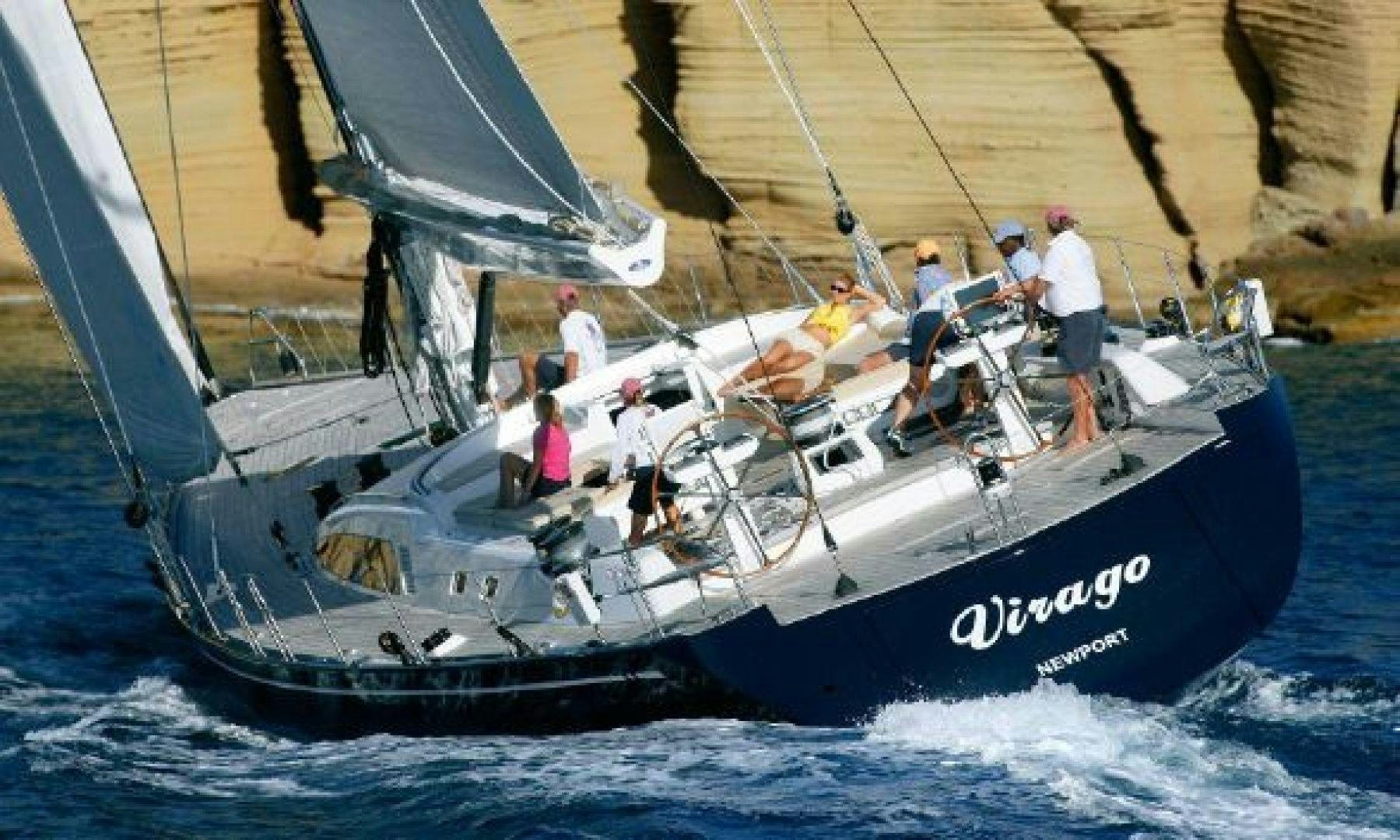 a group of people on a sailboat aboard VIRAGO Yacht for Sale