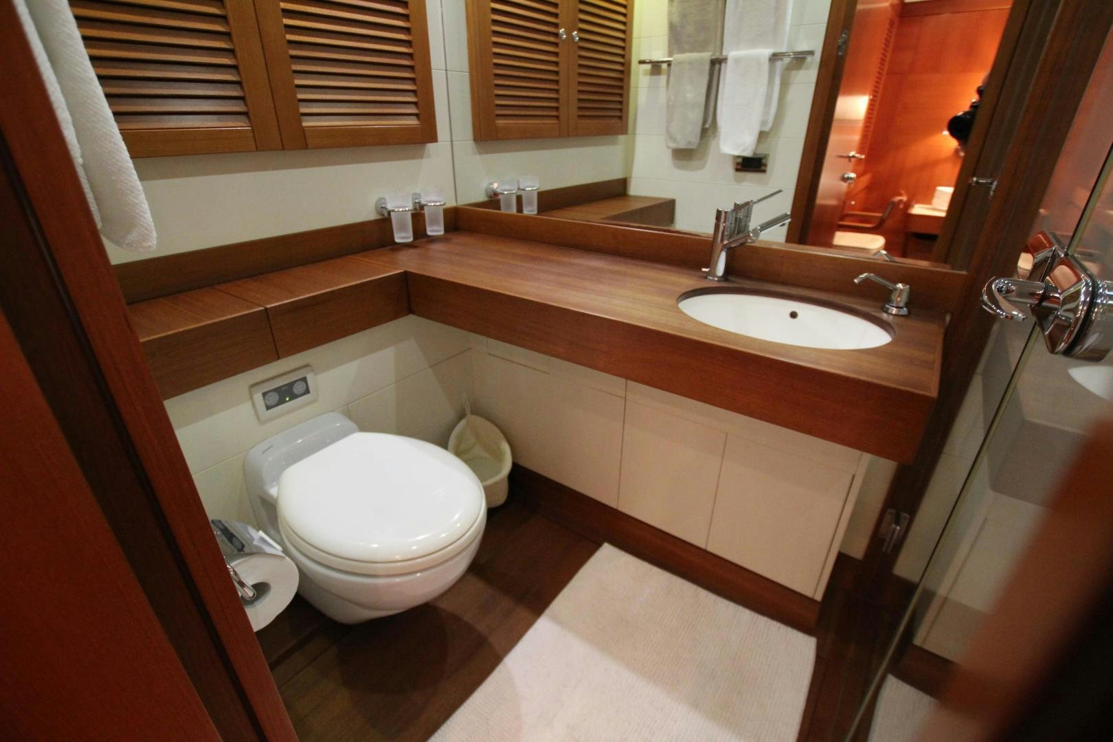 a bathroom with a toilet and a sink aboard VIRAGO Yacht for Sale