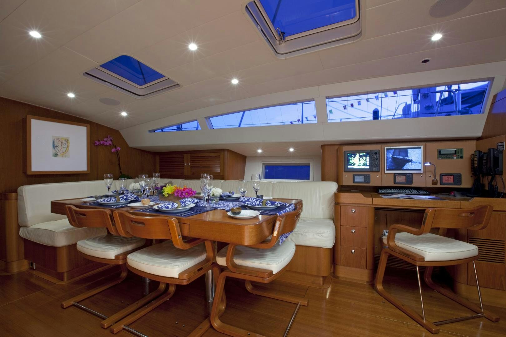 a room with a table and chairs aboard VIRAGO Yacht for Sale