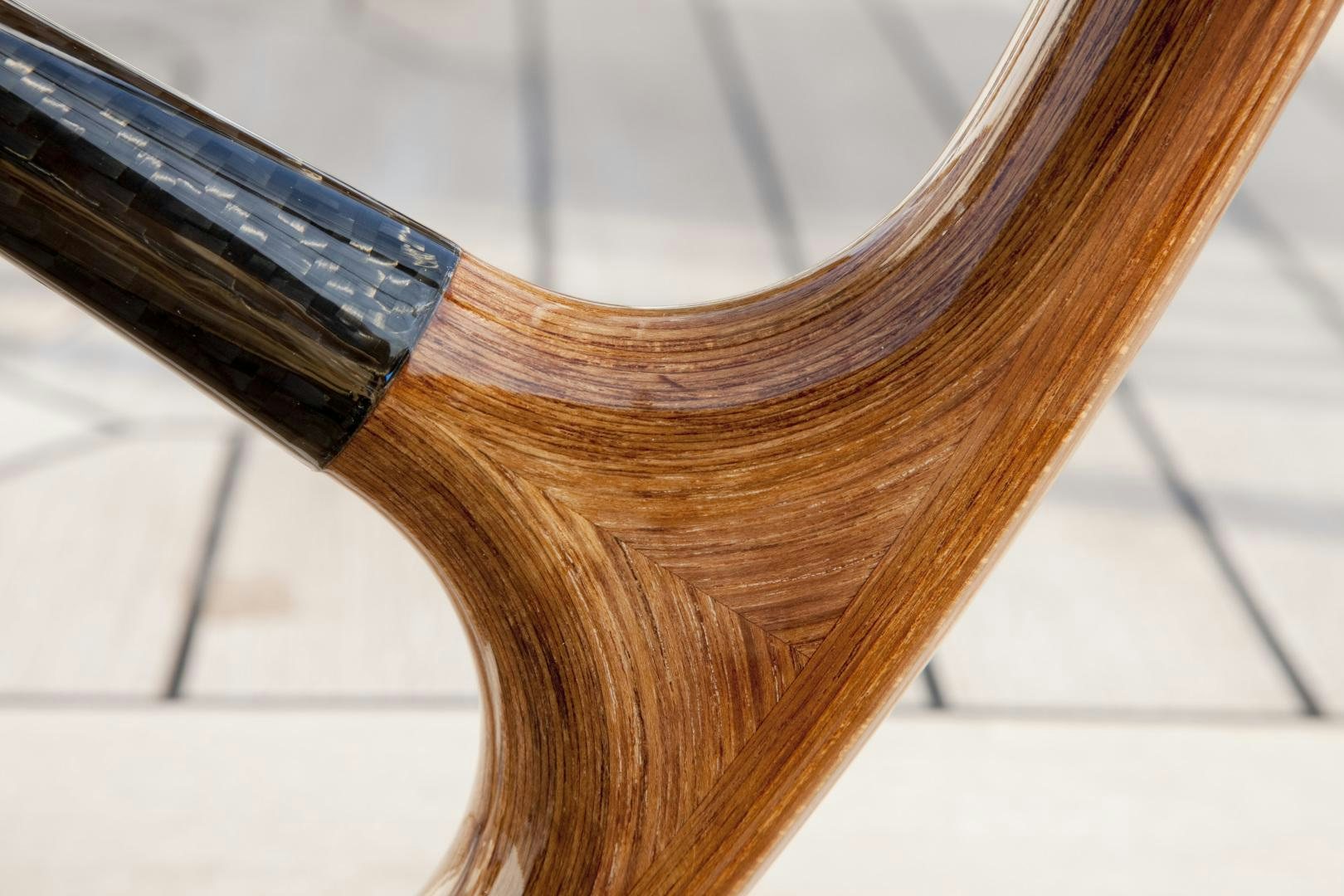 a close-up of a wooden chair aboard VIRAGO Yacht for Sale