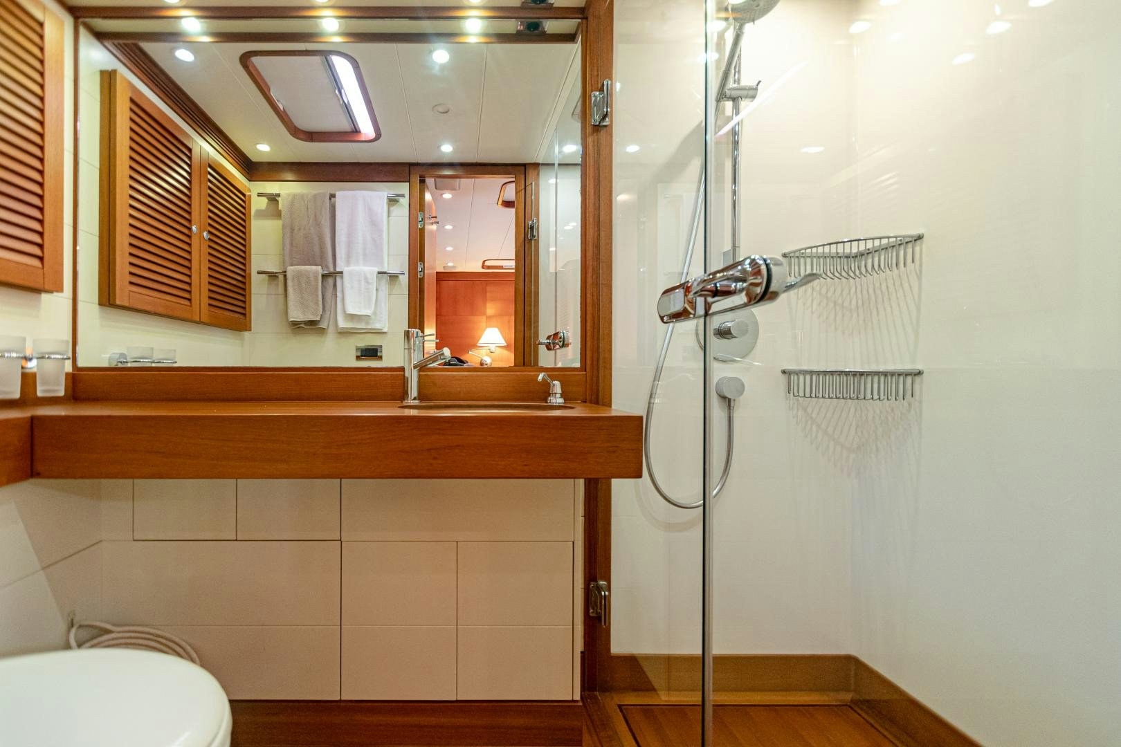 a bathroom with a shower unit and a sink aboard VIRAGO Yacht for Sale