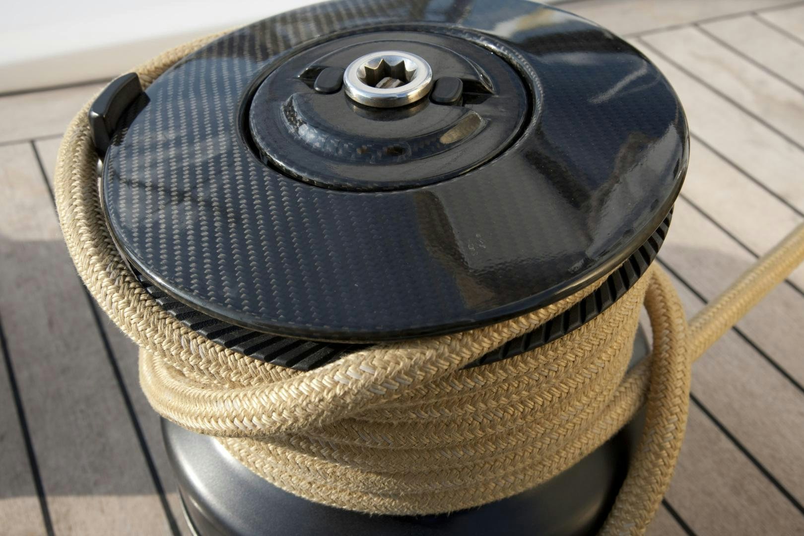 a black tire on a wooden surface aboard VIRAGO Yacht for Sale