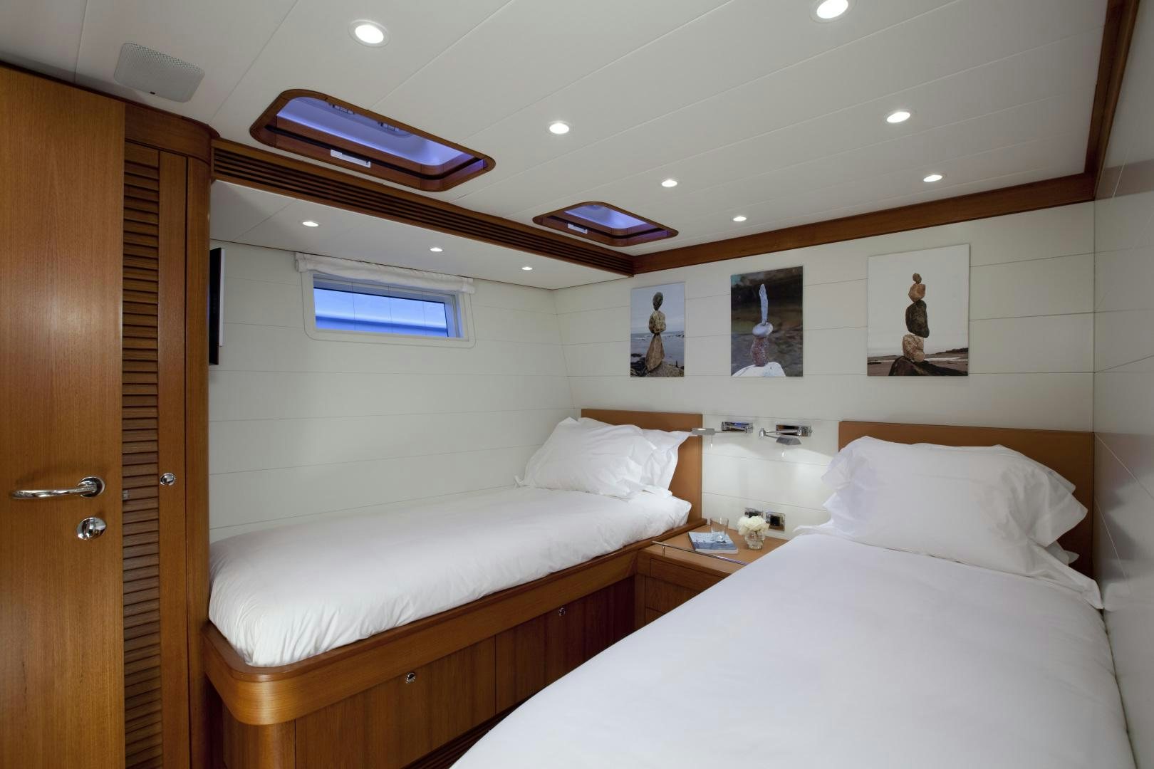 a room with two beds aboard VIRAGO Yacht for Sale