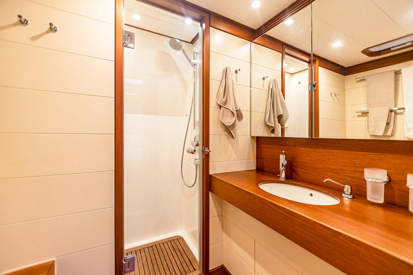 a bathroom with a shower and sink aboard VIRAGO Yacht for Sale