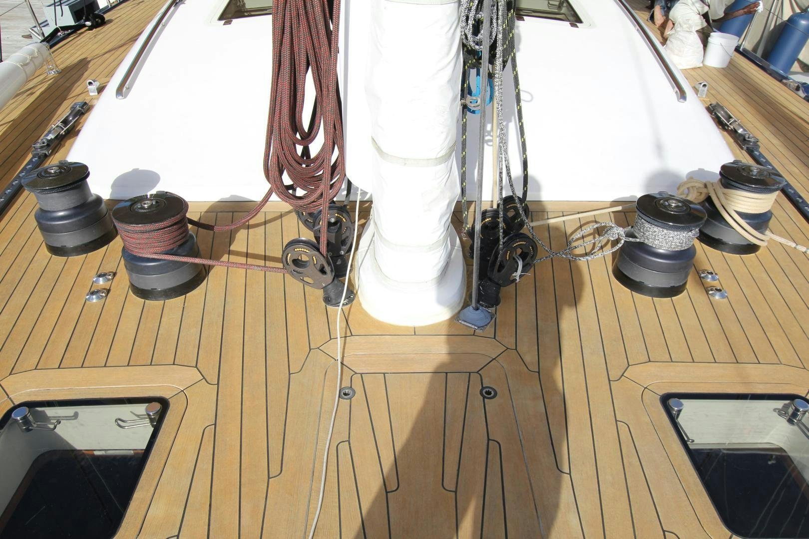 a room with a wood floor and a white dress on the ceiling aboard VIRAGO Yacht for Sale
