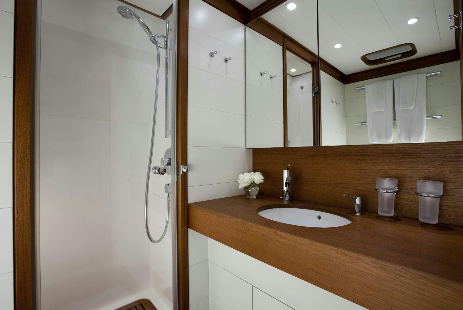 a bathroom with a shower and sink aboard VIRAGO Yacht for Sale