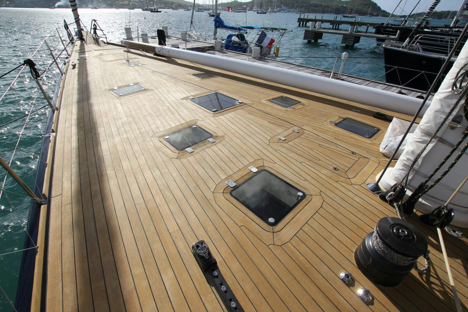 a deck with a black car parked on it aboard VIRAGO Yacht for Sale