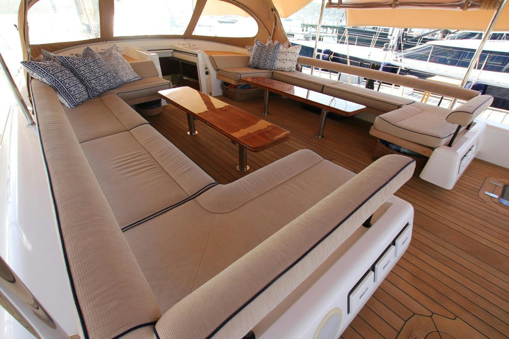 a room with a couch and a table with chairs aboard VIRAGO Yacht for Sale