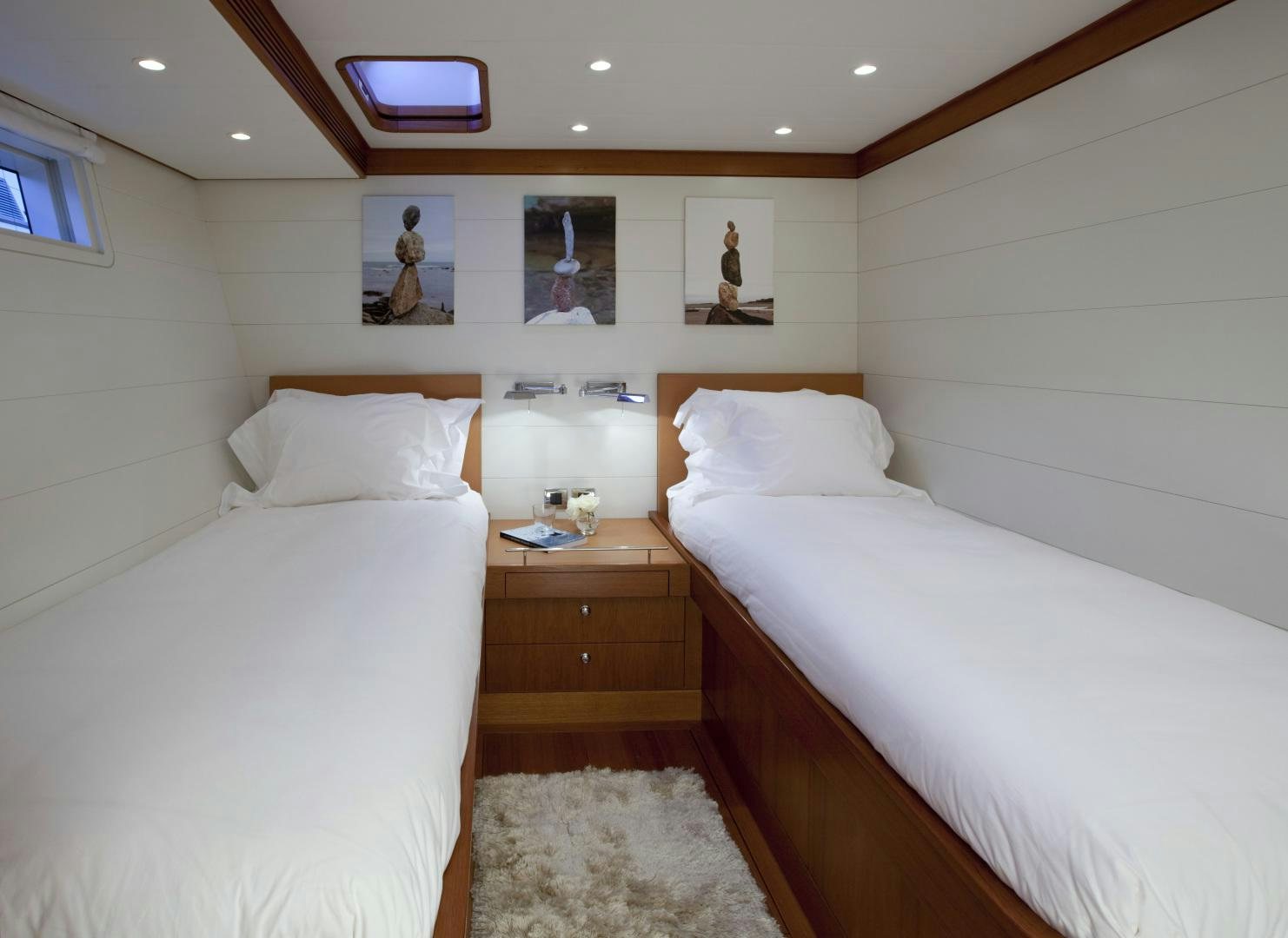 a room with two beds aboard VIRAGO Yacht for Sale