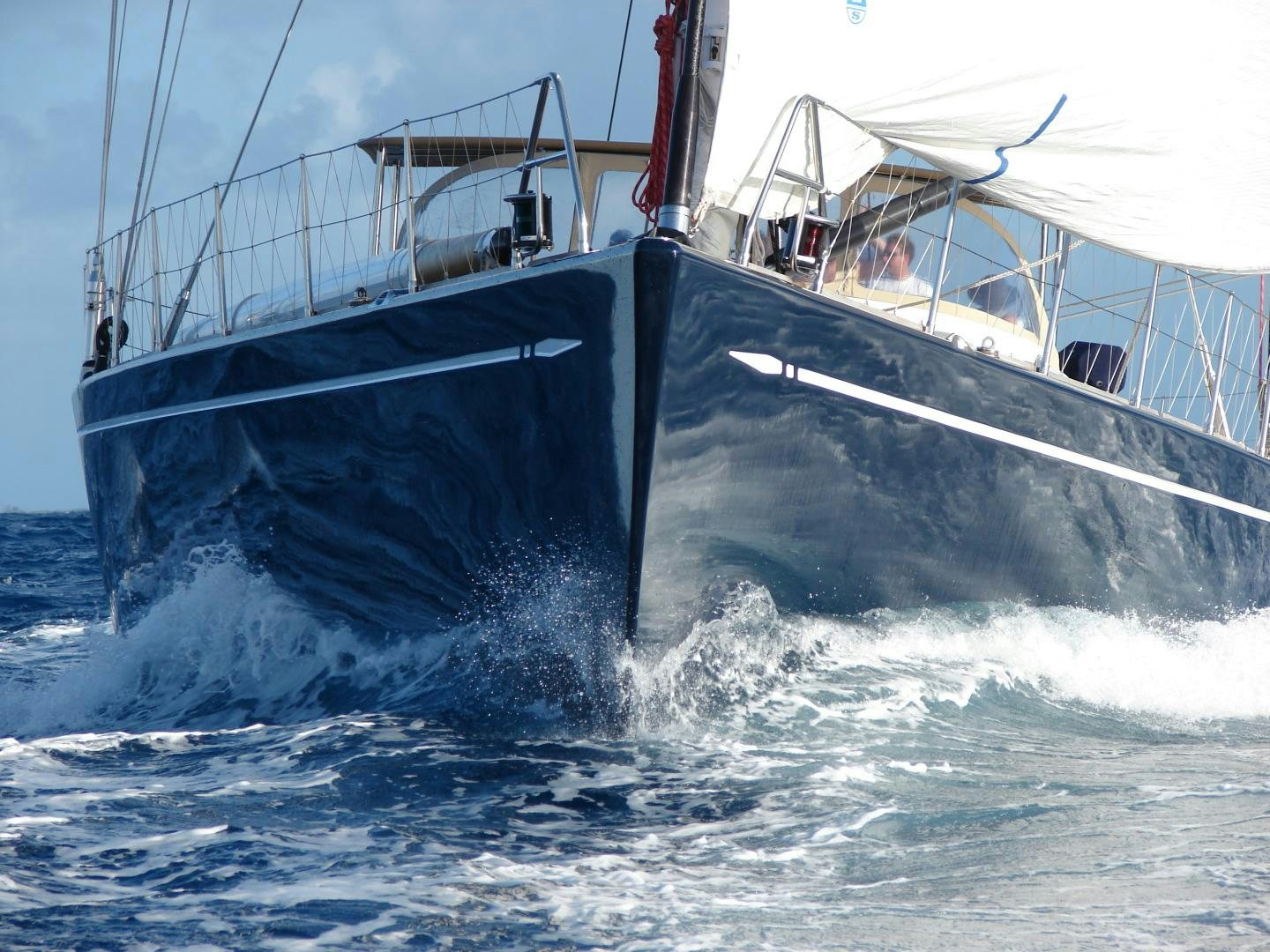 a boat crashing on the water aboard VIRAGO Yacht for Sale
