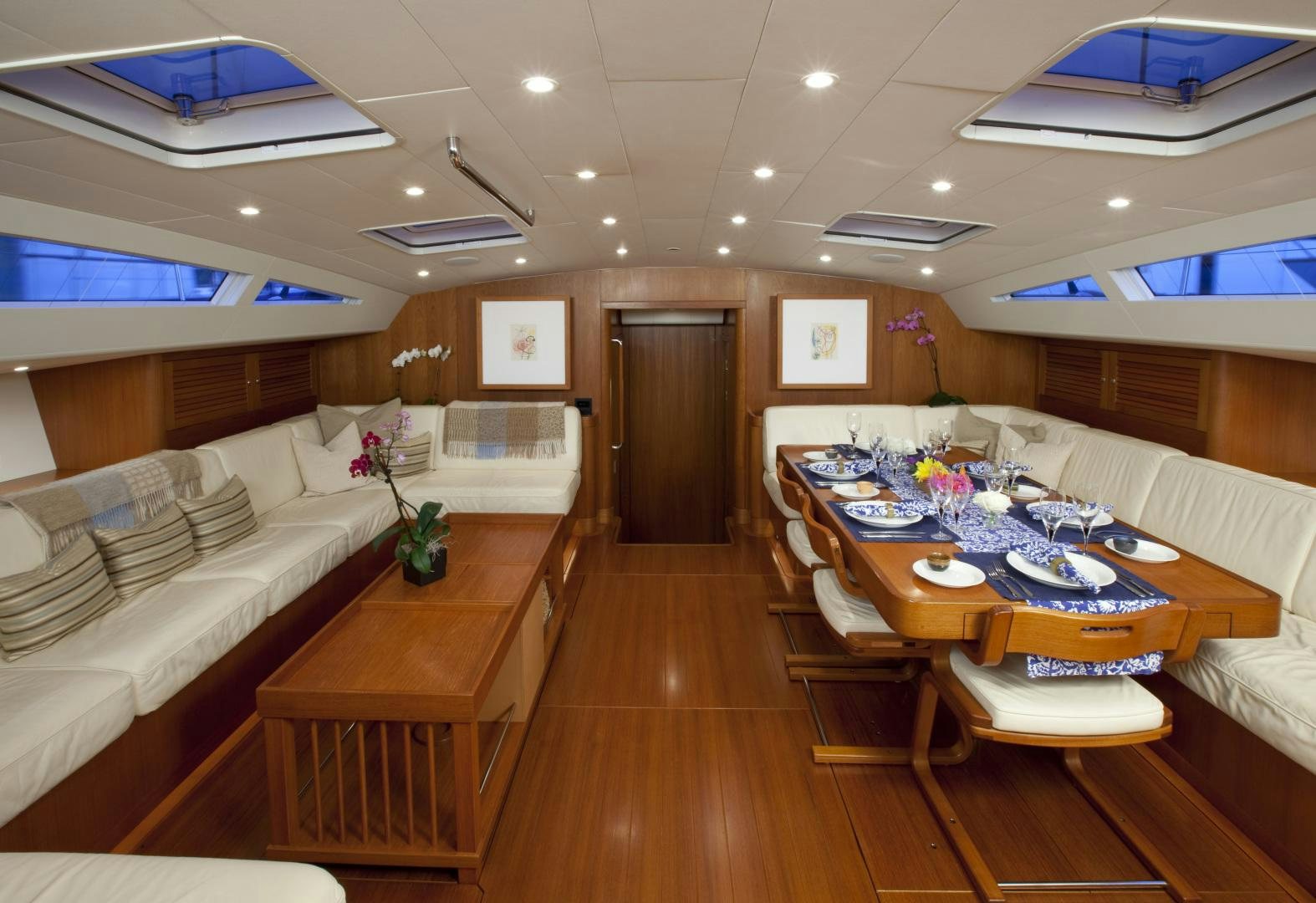 a large room with a wood floor and a large window aboard VIRAGO Yacht for Sale