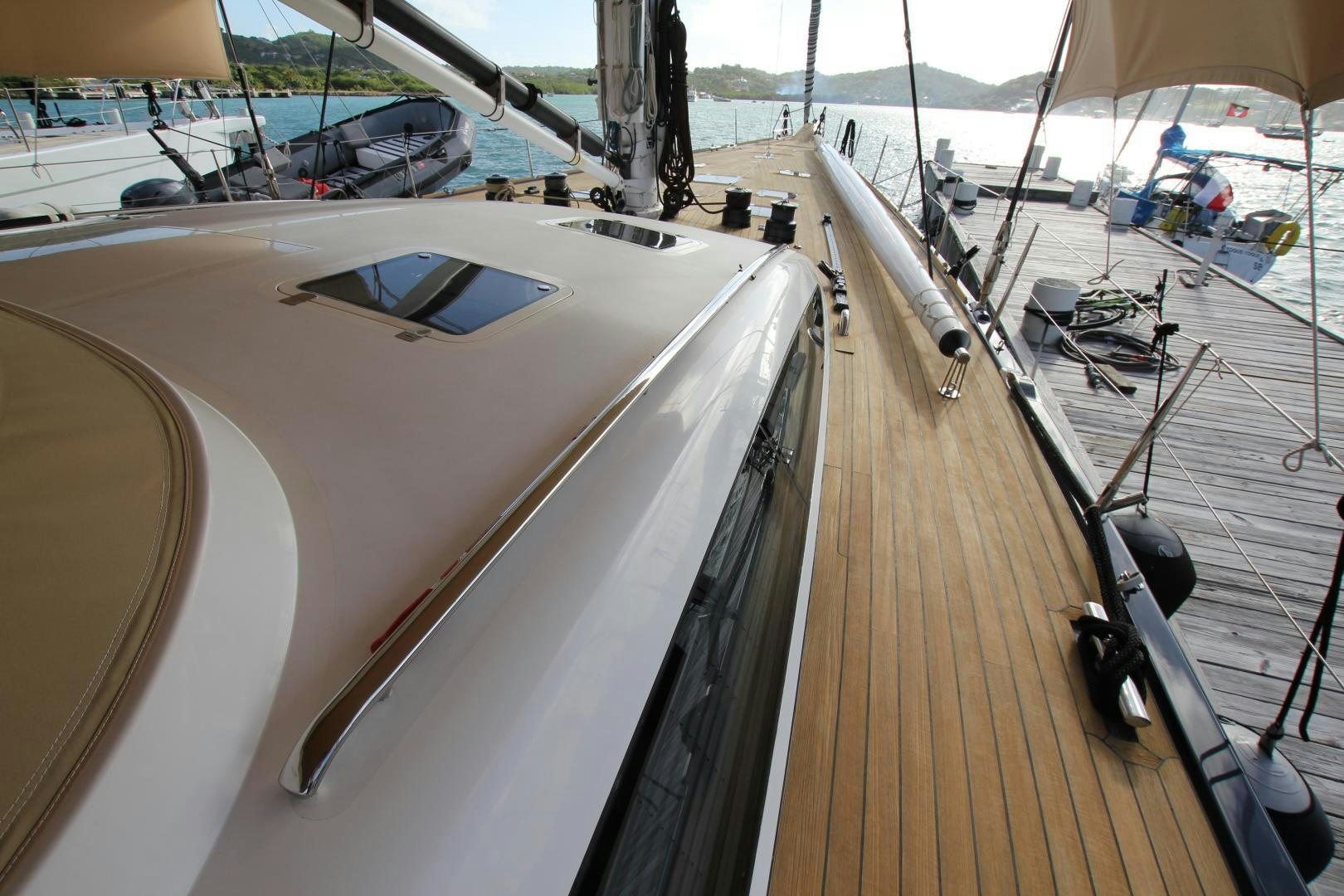 a large wooden boat aboard VIRAGO Yacht for Sale